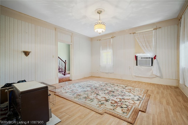 interior space featuring light hardwood / wood-style floors and cooling unit