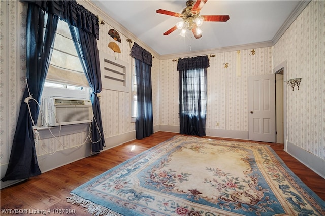 interior space featuring hardwood / wood-style floors, ceiling fan, cooling unit, and ornamental molding