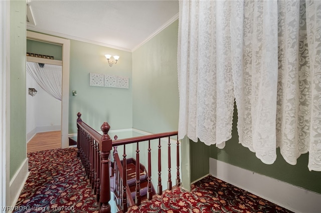 stairs with carpet and crown molding