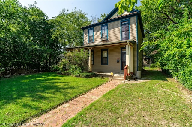 view of front of property featuring a porch, cooling unit, and a front yard