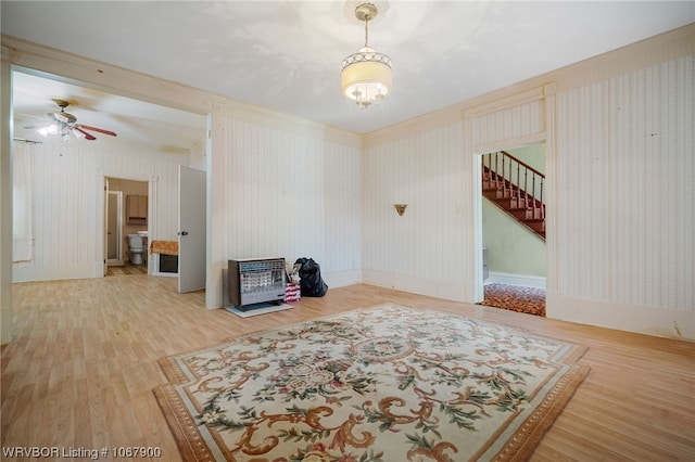 empty room with hardwood / wood-style flooring and ceiling fan