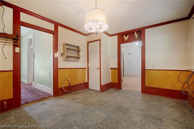 spare room featuring crown molding