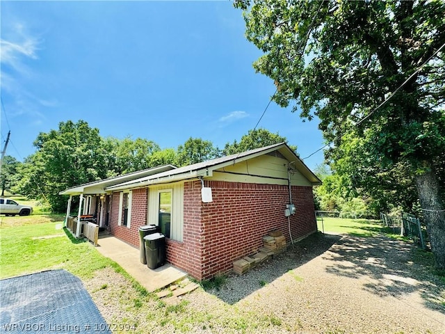 view of home's exterior featuring a yard