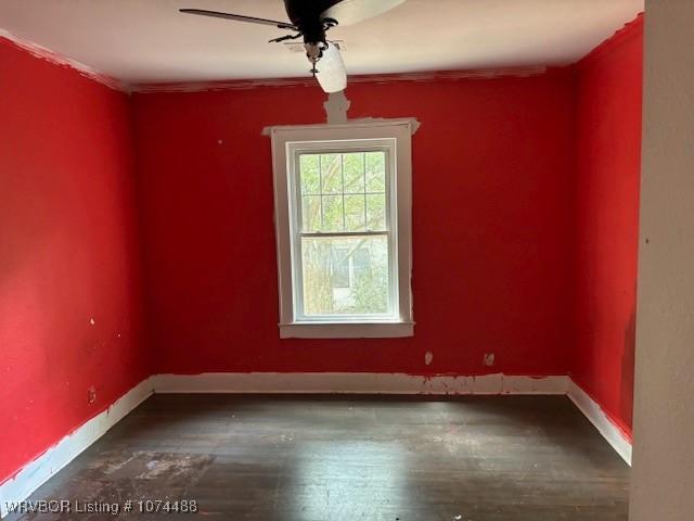 unfurnished room featuring hardwood / wood-style flooring and ceiling fan