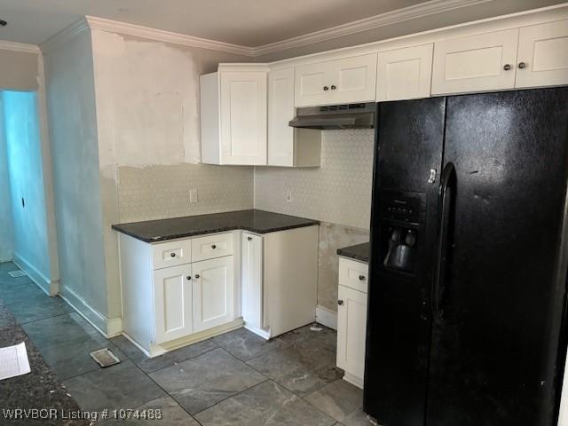 kitchen featuring backsplash, black refrigerator with ice dispenser, crown molding, range hood, and white cabinetry