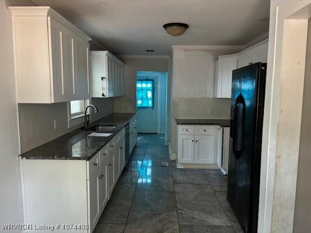 kitchen featuring white cabinets, crown molding, sink, tasteful backsplash, and black fridge with ice dispenser