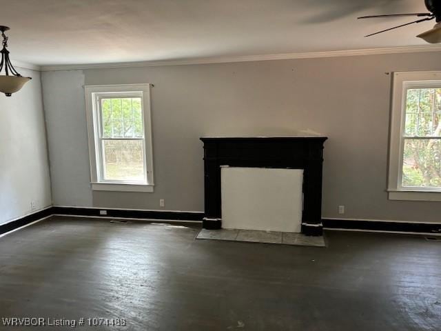 unfurnished living room featuring ceiling fan and crown molding