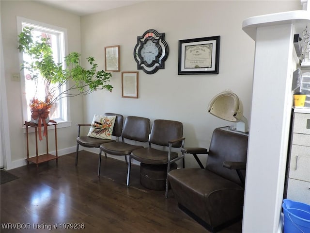 living area featuring wood finished floors and baseboards