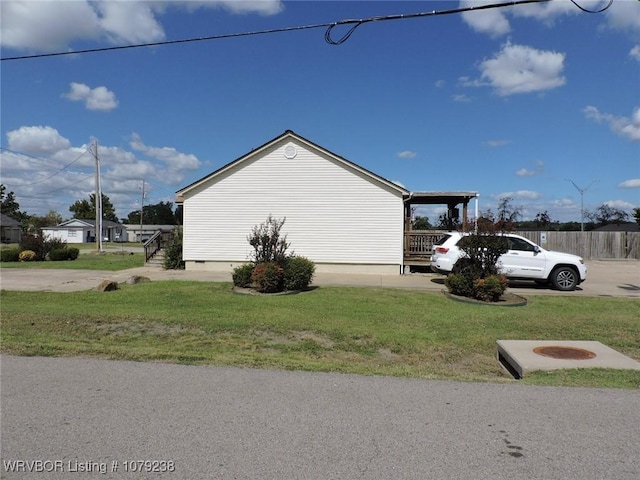 view of property exterior with crawl space and a yard