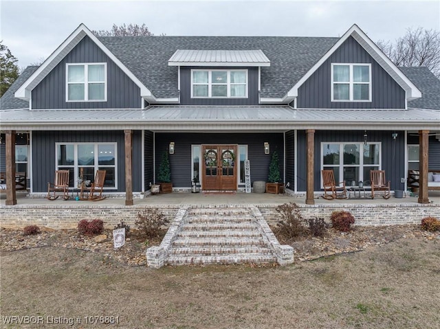 view of front facade with french doors and covered porch