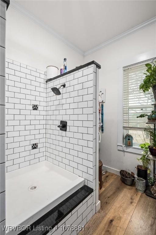 bathroom with vanity, a bathtub, and ornamental molding