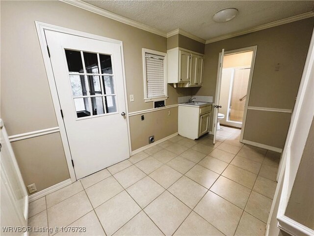 1900 Bottom Fork Rd, Mansfield, AR 72944 - washroom with cabinets, electric dryer hookup, a textured ceiling, light tile patterned floors, and ornamental molding