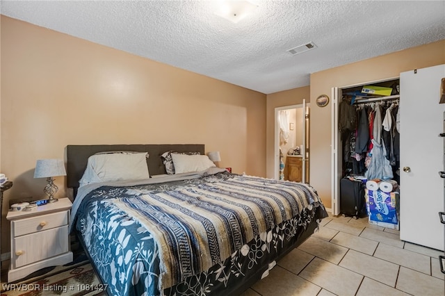 3500 N 48th St, Fort Smith, AR 72904 - tiled bedroom featuring a textured ceiling and a closet
