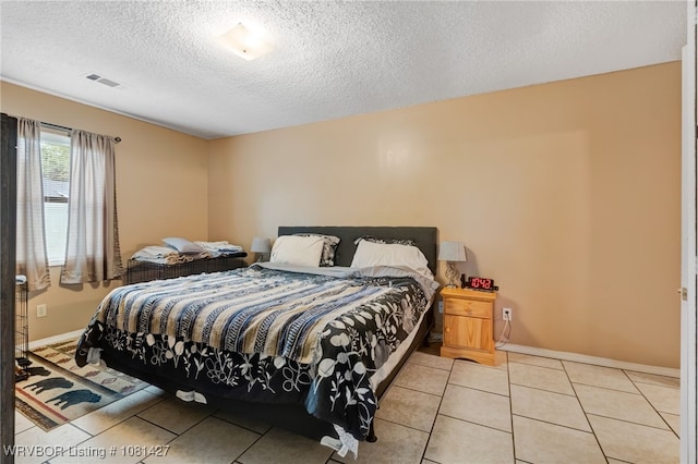 3500 N 48th St, Fort Smith, AR 72904 - bedroom with light tile patterned flooring, baseboards, and a textured ceiling