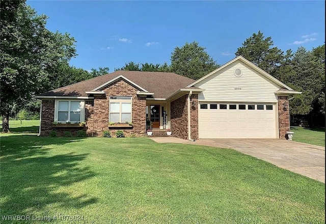 single story home with a front yard and a garage