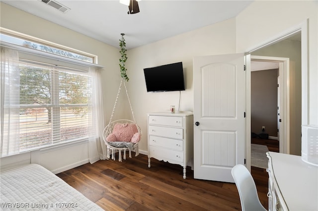 bedroom featuring ceiling fan and dark hardwood / wood-style flooring