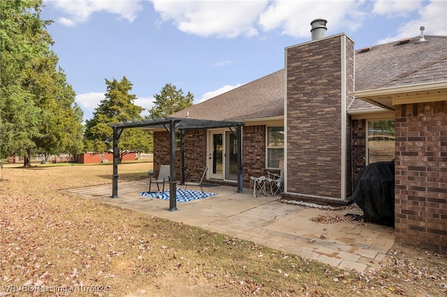 back of house featuring a pergola and a patio