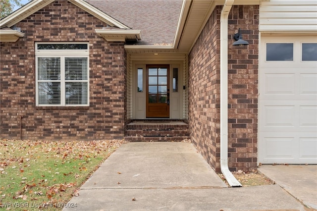 entrance to property featuring a garage