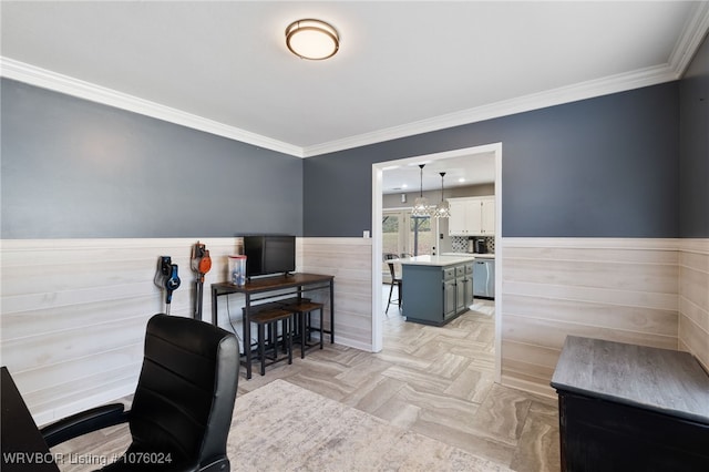 home office with light parquet floors, a chandelier, and ornamental molding