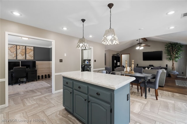 kitchen with a center island, lofted ceiling with beams, blue cabinets, pendant lighting, and ceiling fan with notable chandelier