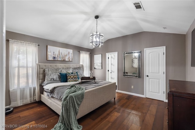 bedroom with multiple windows, dark wood-type flooring, and a chandelier