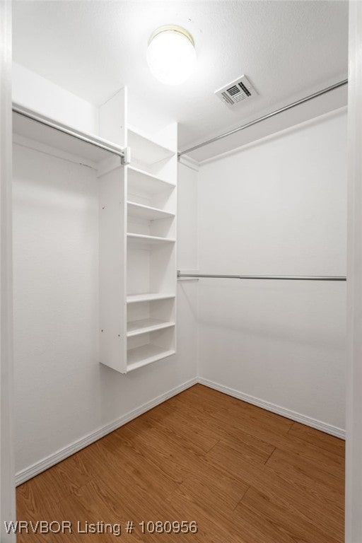 813 Melba Denton Ln, Sallisaw, OK 74955 - walk in closet featuring wood finished floors