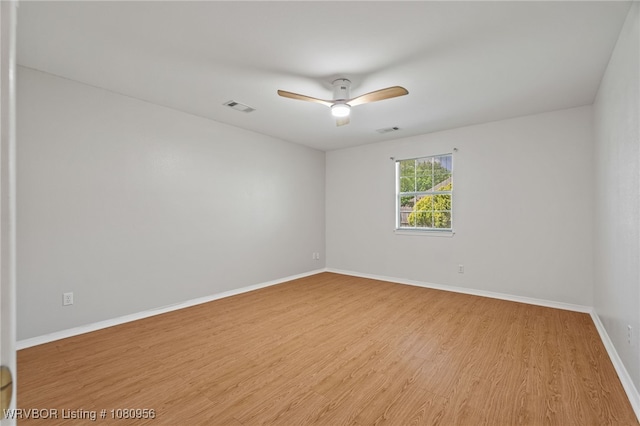 813 Melba Denton Ln, Sallisaw, OK 74955 - spare room with ceiling fan, wood finished floors, and baseboards
