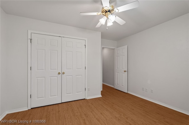 813 Melba Denton Ln, Sallisaw, OK 74955 - unfurnished bedroom featuring light wood-type flooring, baseboards, a closet, and ceiling fan