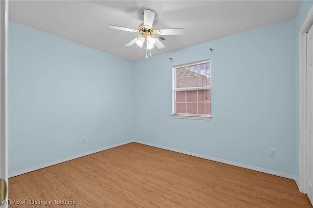 813 Melba Denton Ln, Sallisaw, OK 74955 - unfurnished room with wood finished floors, baseboards, and a ceiling fan