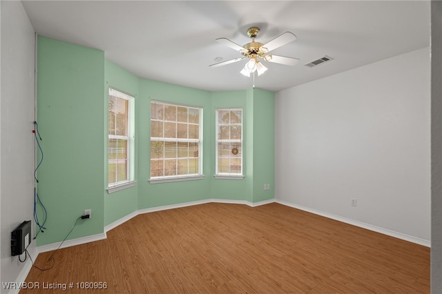 813 Melba Denton Ln, Sallisaw, OK 74955 - unfurnished room featuring wood finished floors, a ceiling fan, and baseboards