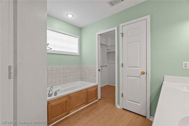 813 Melba Denton Ln, Sallisaw, OK 74955 - full bath with a bath, wood finished floors, and baseboards
