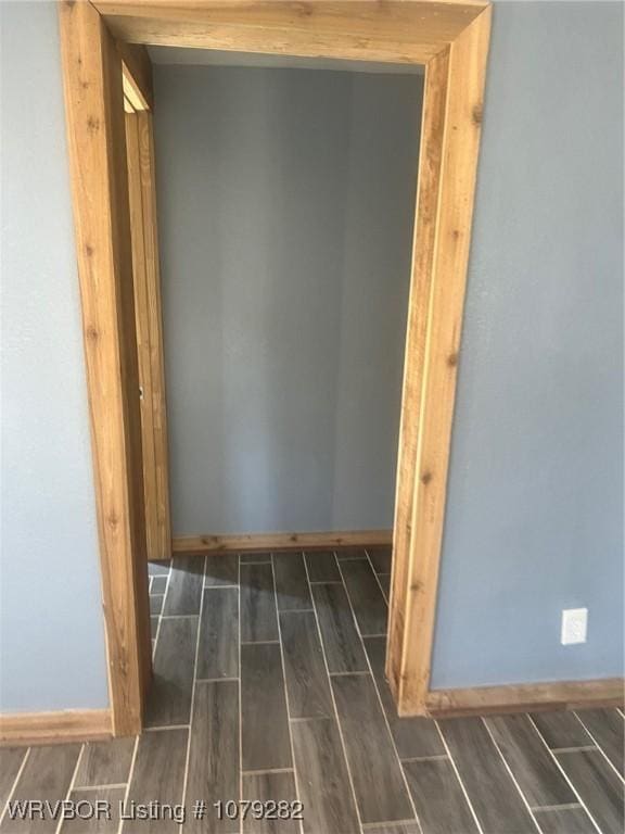 bathroom featuring wood finish floors and baseboards