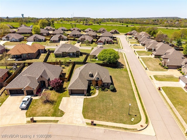 birds eye view of property with a residential view