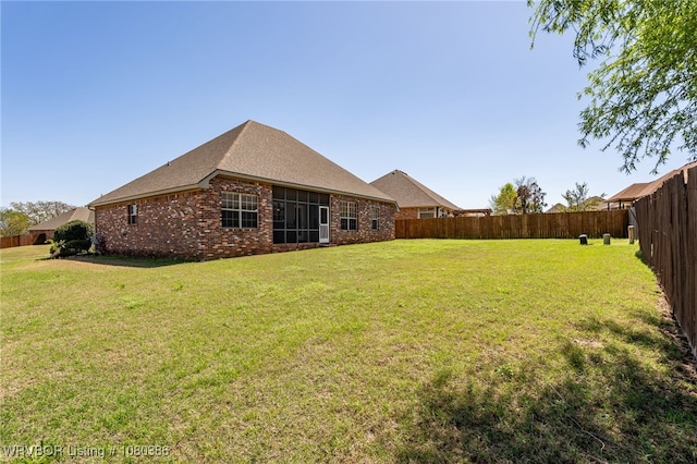 view of yard with a fenced backyard