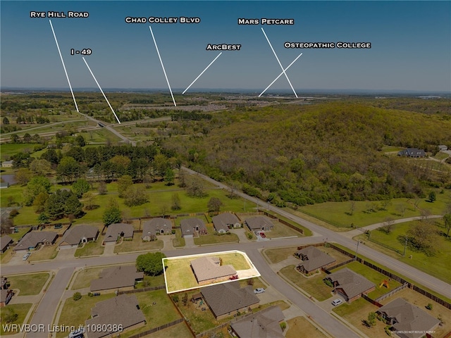 bird's eye view with a residential view and a wooded view