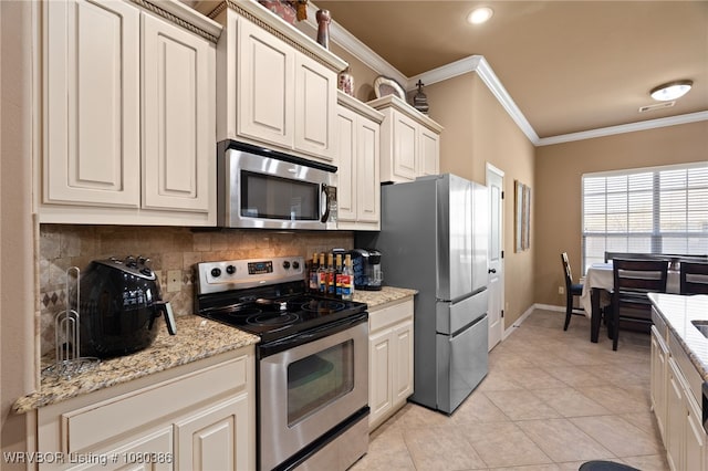 kitchen with stainless steel appliances, light tile patterned flooring, tasteful backsplash, baseboards, and ornamental molding