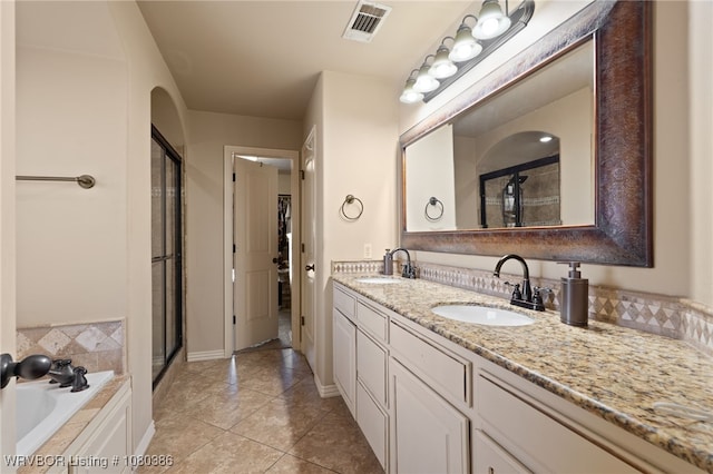 full bathroom featuring a sink, visible vents, and a stall shower