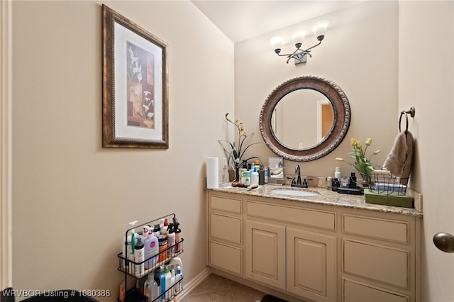 bathroom featuring baseboards, vanity, and tile patterned flooring