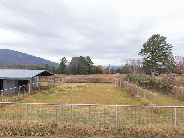 view of yard featuring a mountain view and a rural view