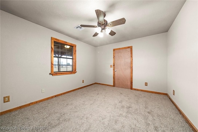 carpeted empty room featuring ceiling fan