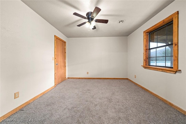 carpeted empty room with ceiling fan