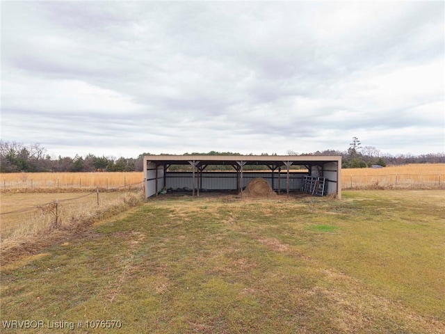 view of outbuilding featuring a rural view