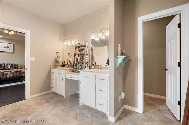 bathroom featuring tile patterned flooring and vanity