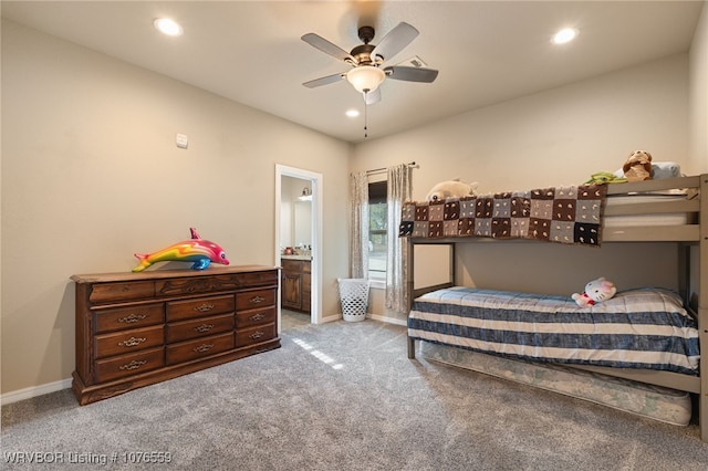 bedroom with light carpet, connected bathroom, and ceiling fan