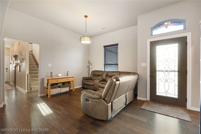 living room with dark hardwood / wood-style flooring