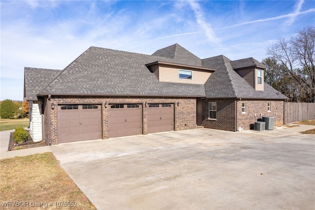 view of side of home with a garage