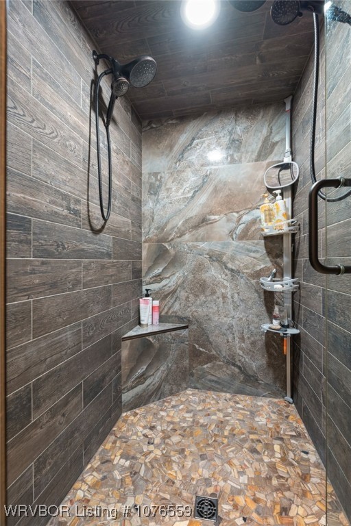 bathroom with a tile shower