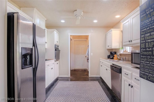 3745 E 420th Rd, Adair, OK 74330 - kitchen with a ceiling fan, baseboards, white cabinetry, and appliances with stainless steel finishes