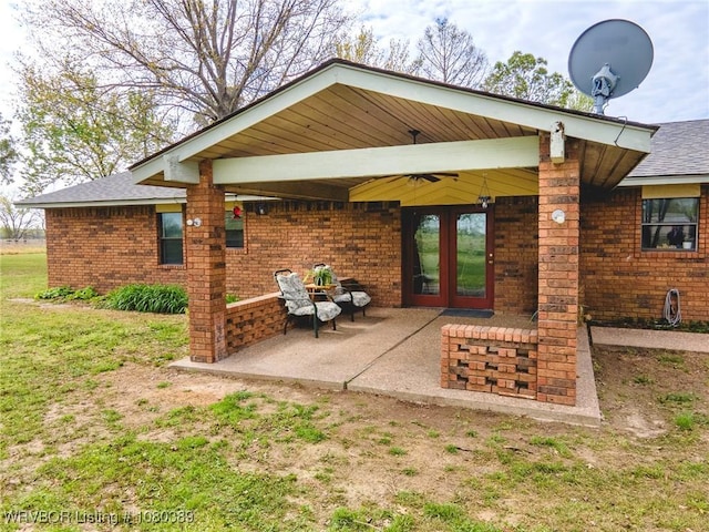 3745 E 420th Rd, Adair, OK 74330 - rear view of house featuring brick siding, roof with shingles, a patio, and french doors