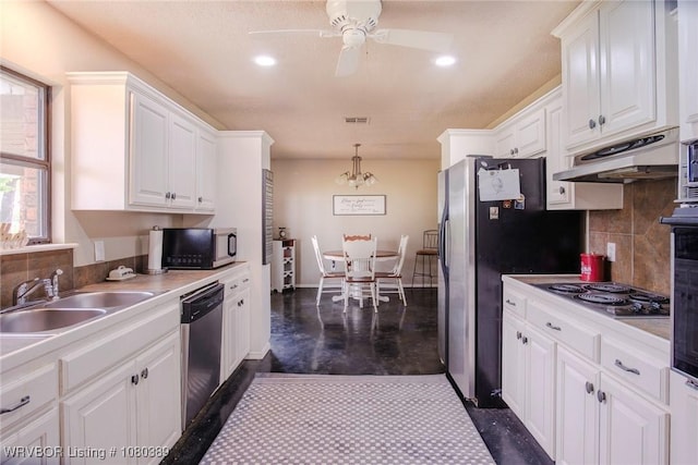 3745 E 420th Rd, Adair, OK 74330 - kitchen featuring white cabinets, under cabinet range hood, stainless steel appliances, backsplash, and a sink